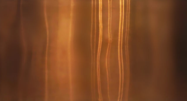 Shiny gold foil, bronze, or copper metal pattern surface texture. Close-up of interior material for design decoration background